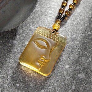 YELLOW BUDDHA NECKLACE